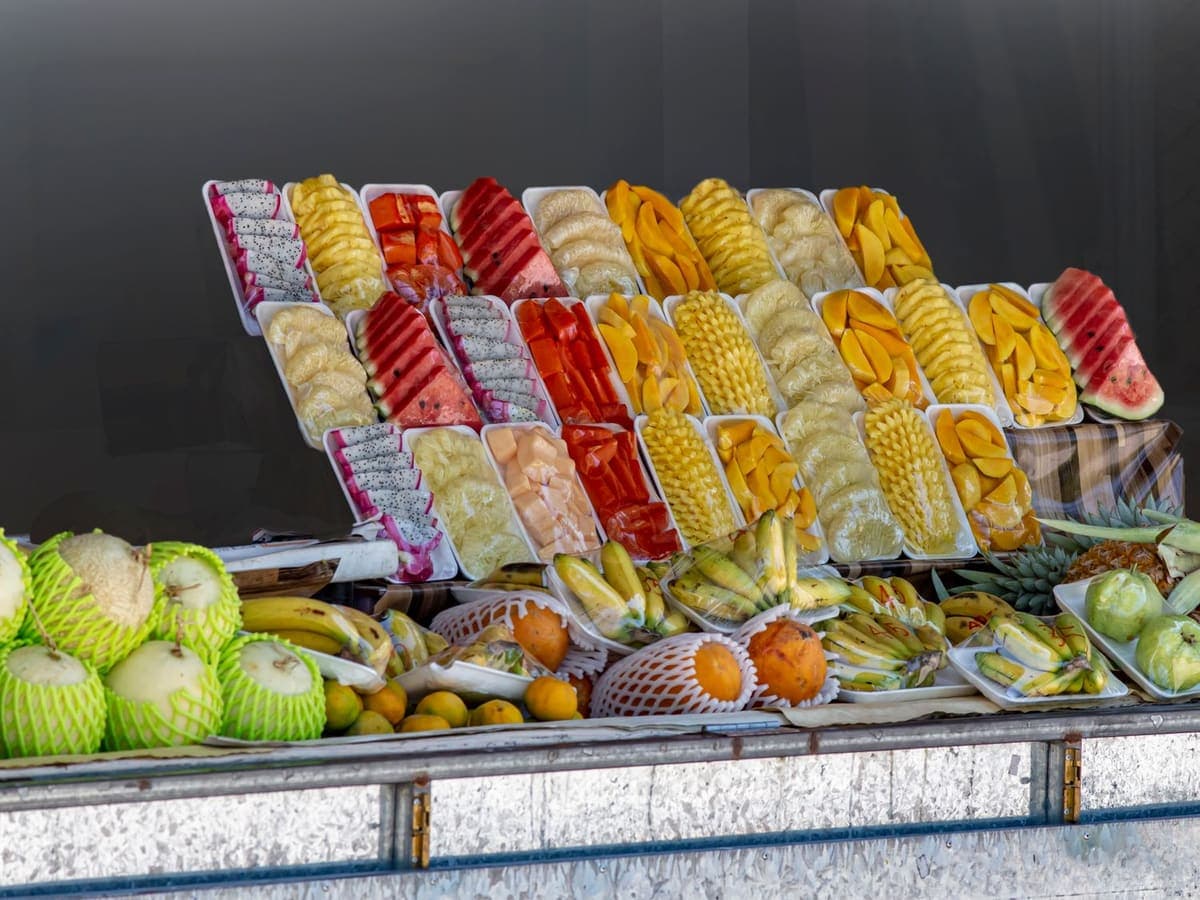 Cartons opened at a destination market, the produce on display.